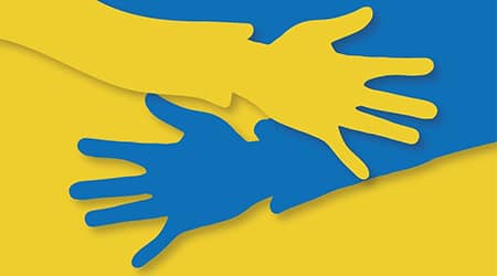 Źródło grafiki: Alexandra_Koch z Pixabay. Grafika przedstawiająca dwie dłonie w barwach ukraińskich.