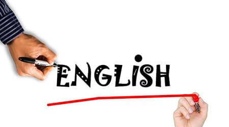 Autor zdjęcia: Tumisu z Pixabay Zdjęcie dwóch dłoni piszących na kartce słowo english.